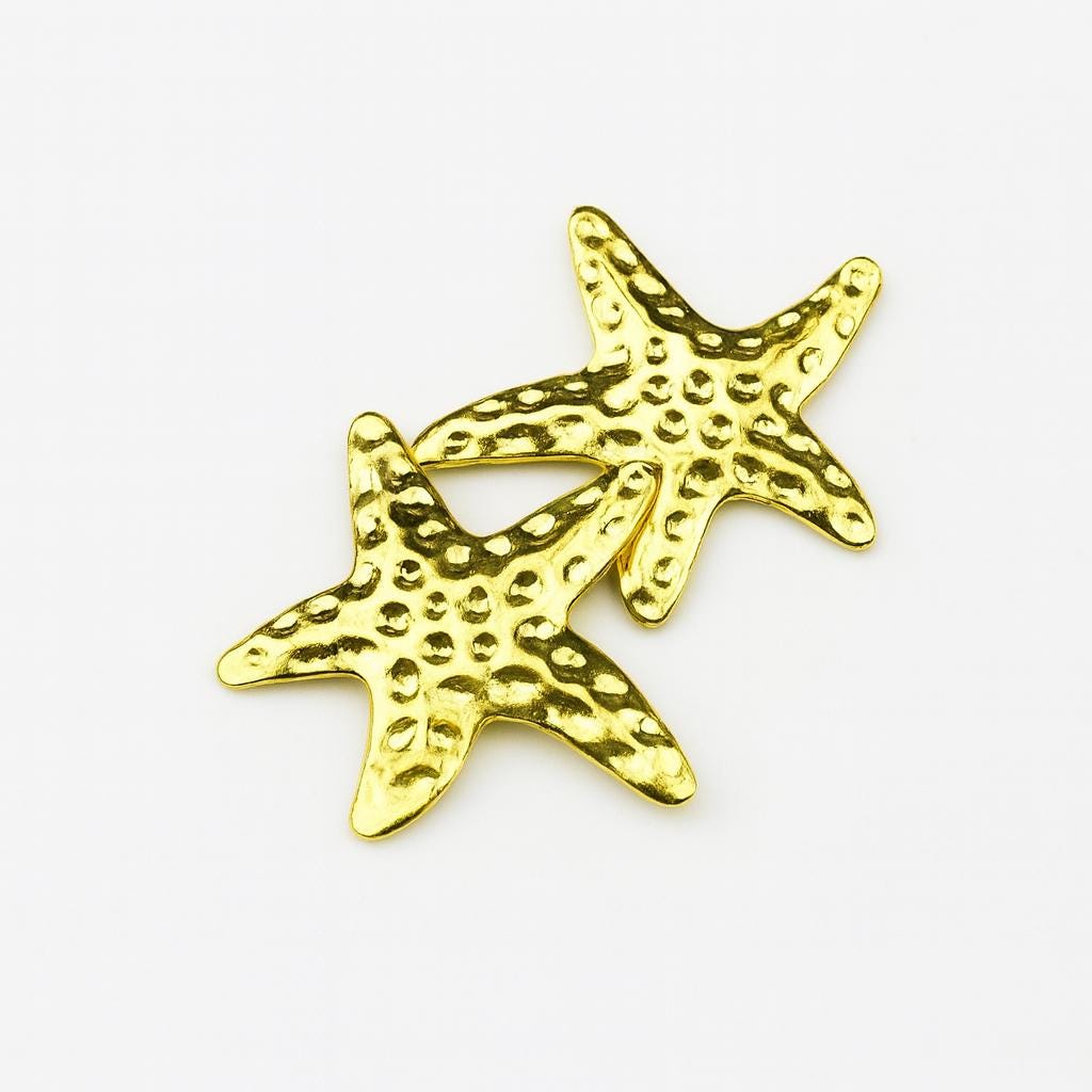 Gold-tone star tooth gem crystals